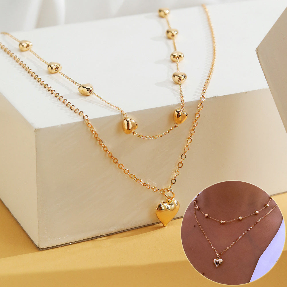 Chaînes dorées à double rang pendentif cœur - StyleNova Paris