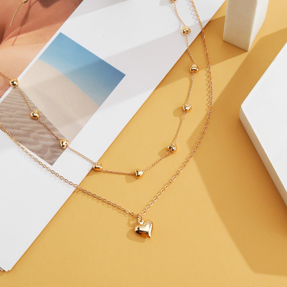 Chaînes dorées à double rang pendentif cœur - StyleNova Paris