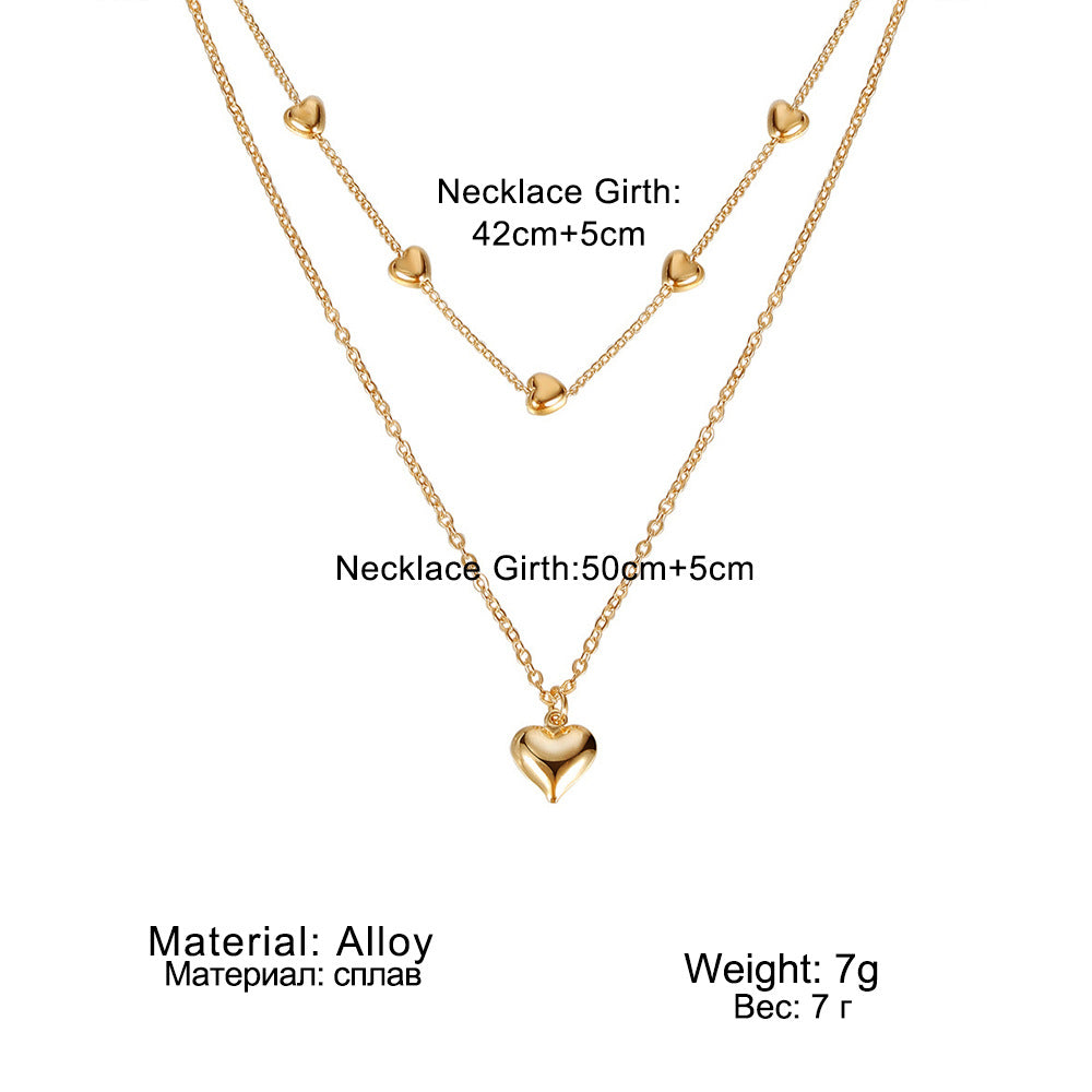 Chaînes dorées à double rang pendentif cœur - StyleNova Paris