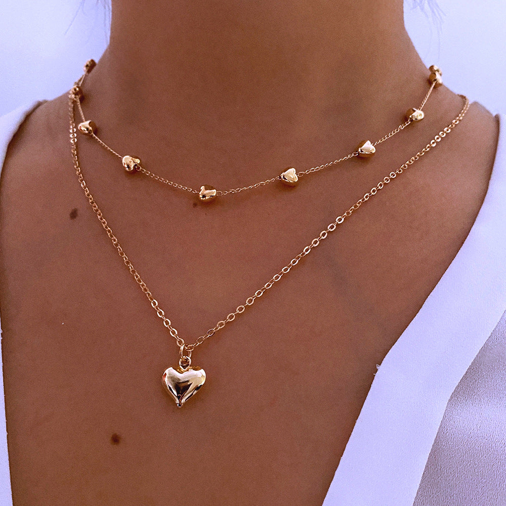 Chaînes dorées à double rang pendentif cœur - StyleNova Paris
